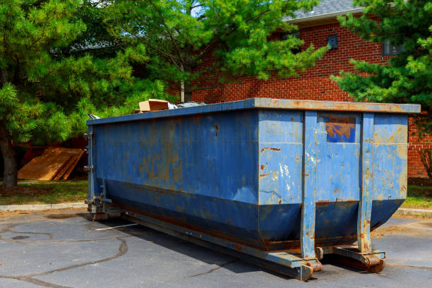 dumpsters being full with garbage in a city. dumpsters being full with garbage